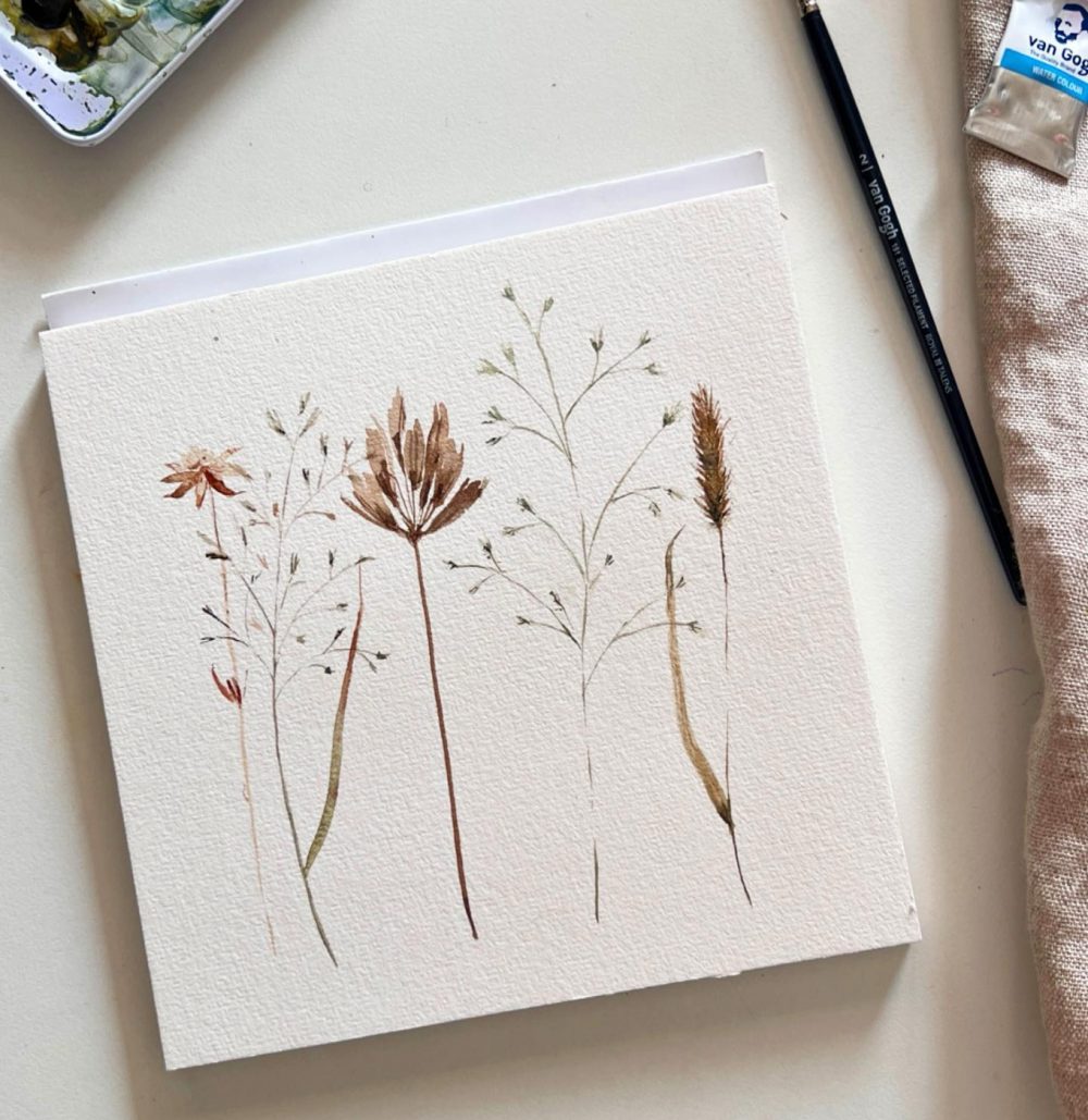 Aquarell getrockneter Wiesenblumen auf Büttenpapier